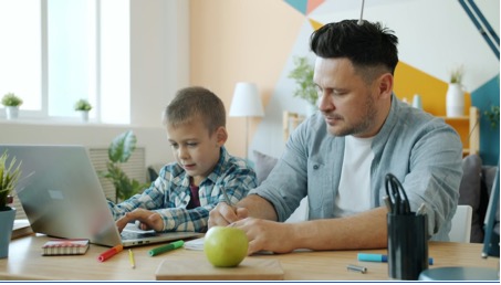 a man with son on computer