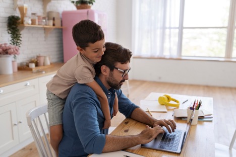 dad and son at laptop
