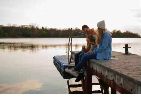 family fishing on pier