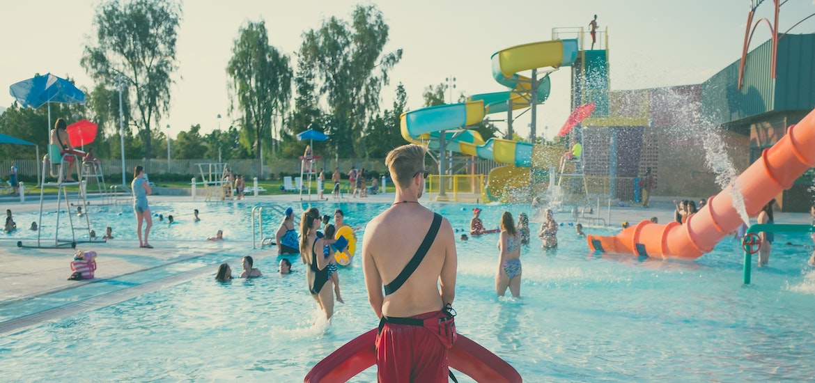a lifeguard watches a waterpark