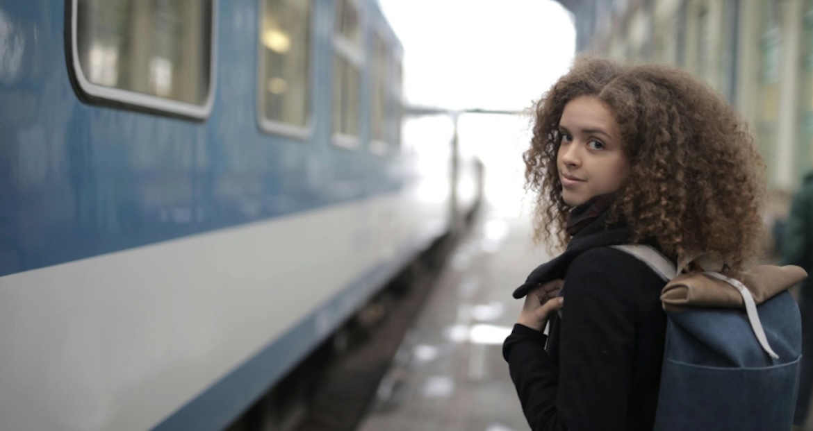 Female student about to board train