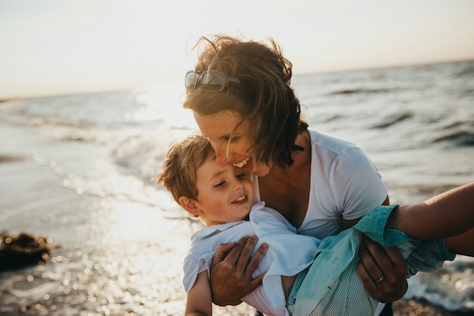 mom and son on beach