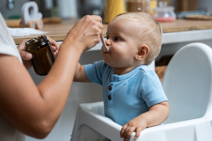 dad feeds baby