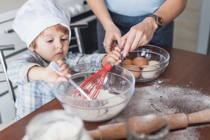 boy baking with dad