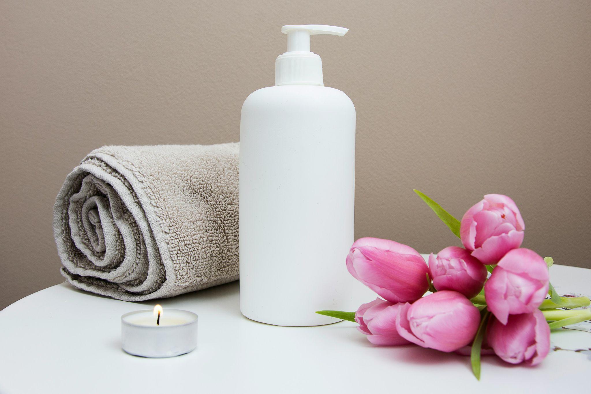 spa layout of towels and candles