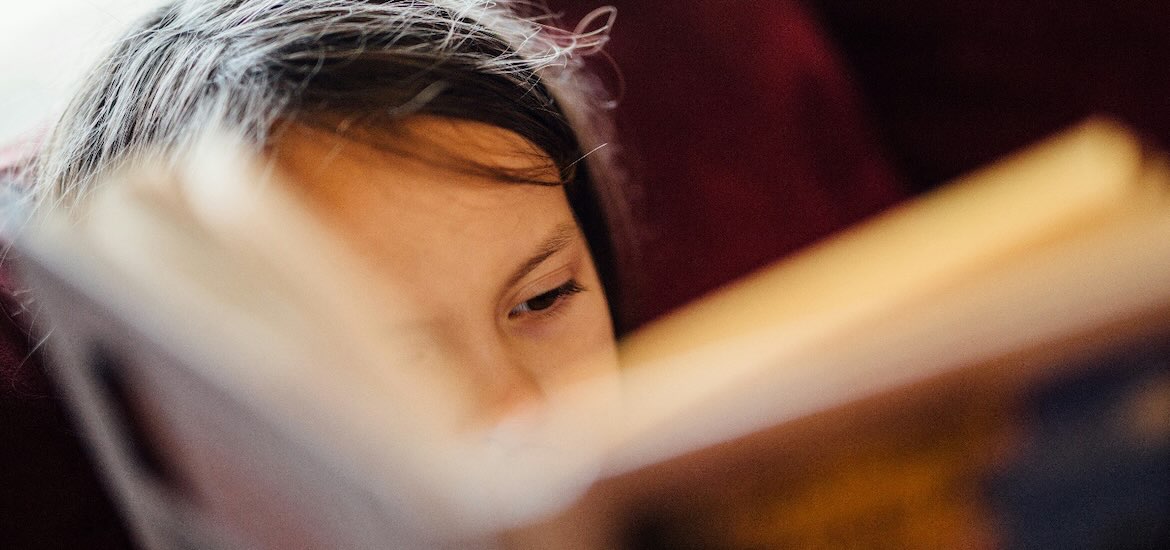 kid reading book