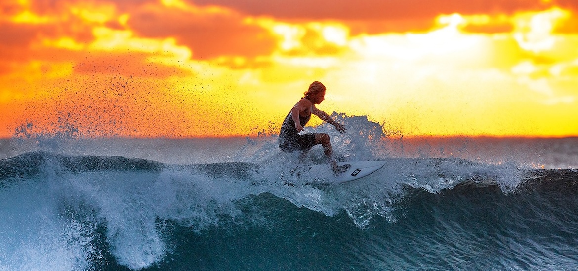 Surfing at sunrise