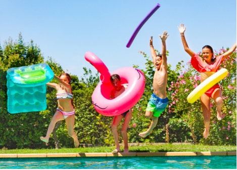 kids jump in a pool