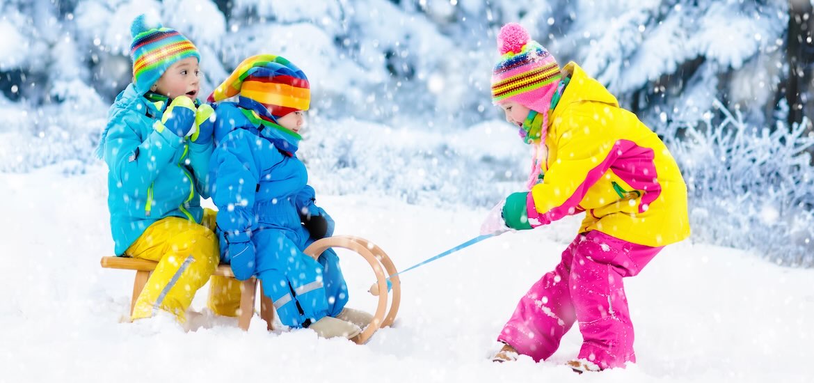 small children play on a sledge