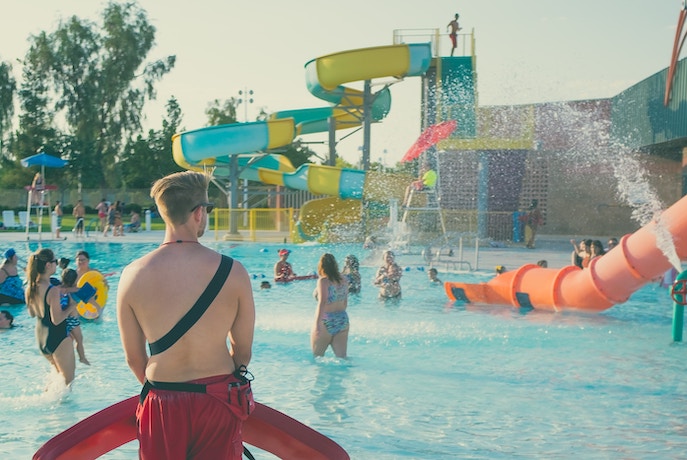 a lifeguard watches over a waterpark