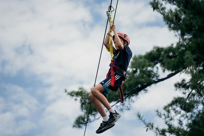 Boy ziplining