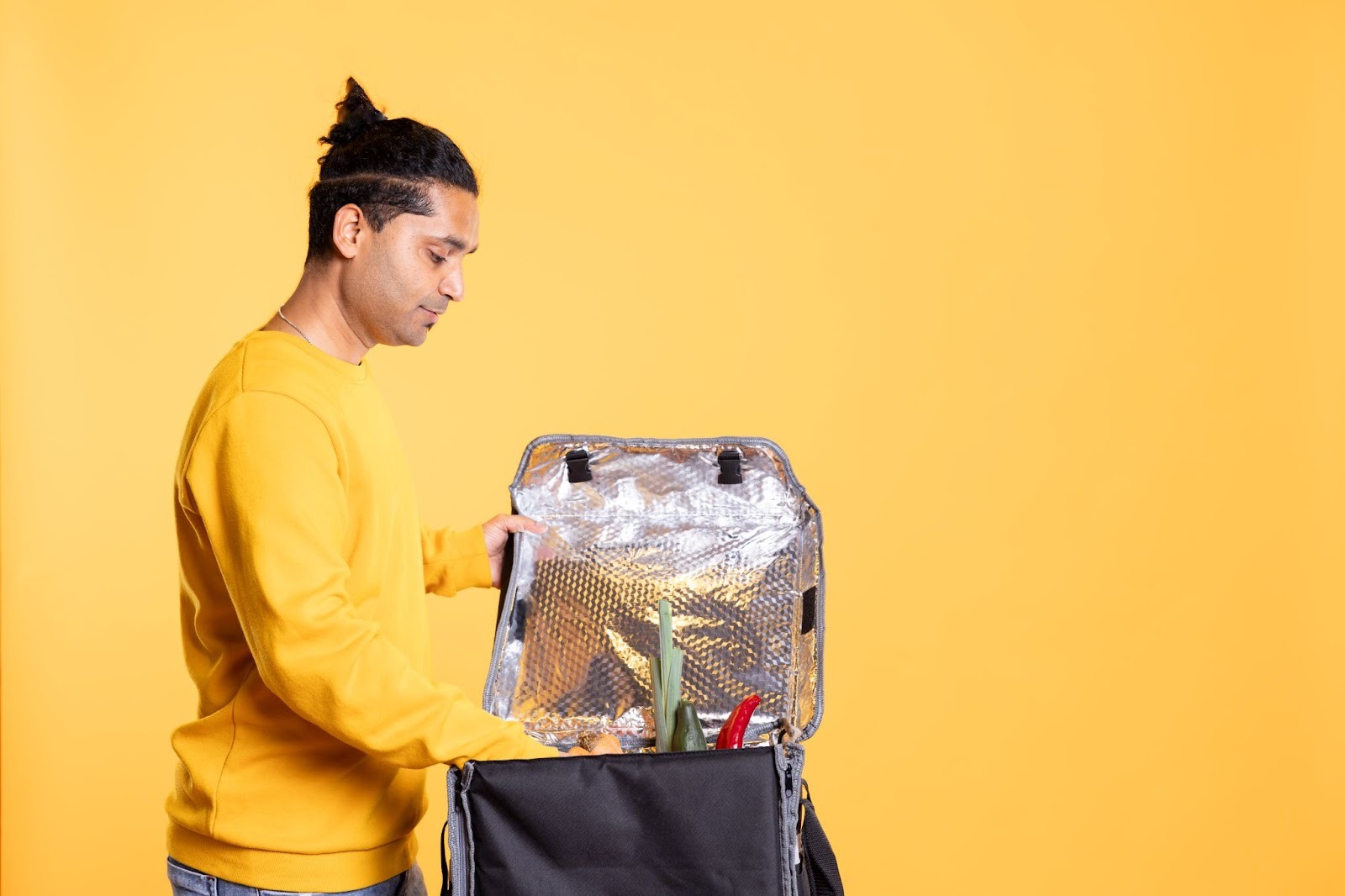 A man packs his travel bag
