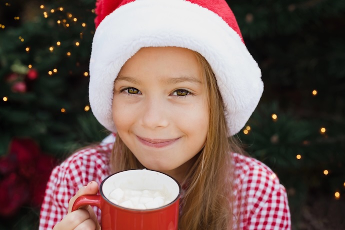 girl enjoys hot chocolate