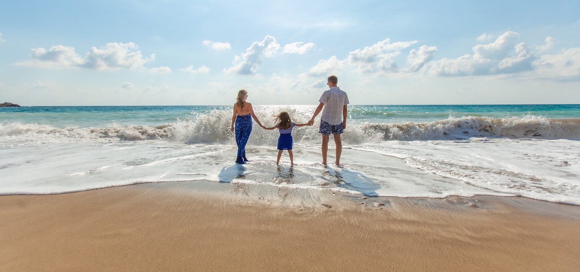 a family on a beach together