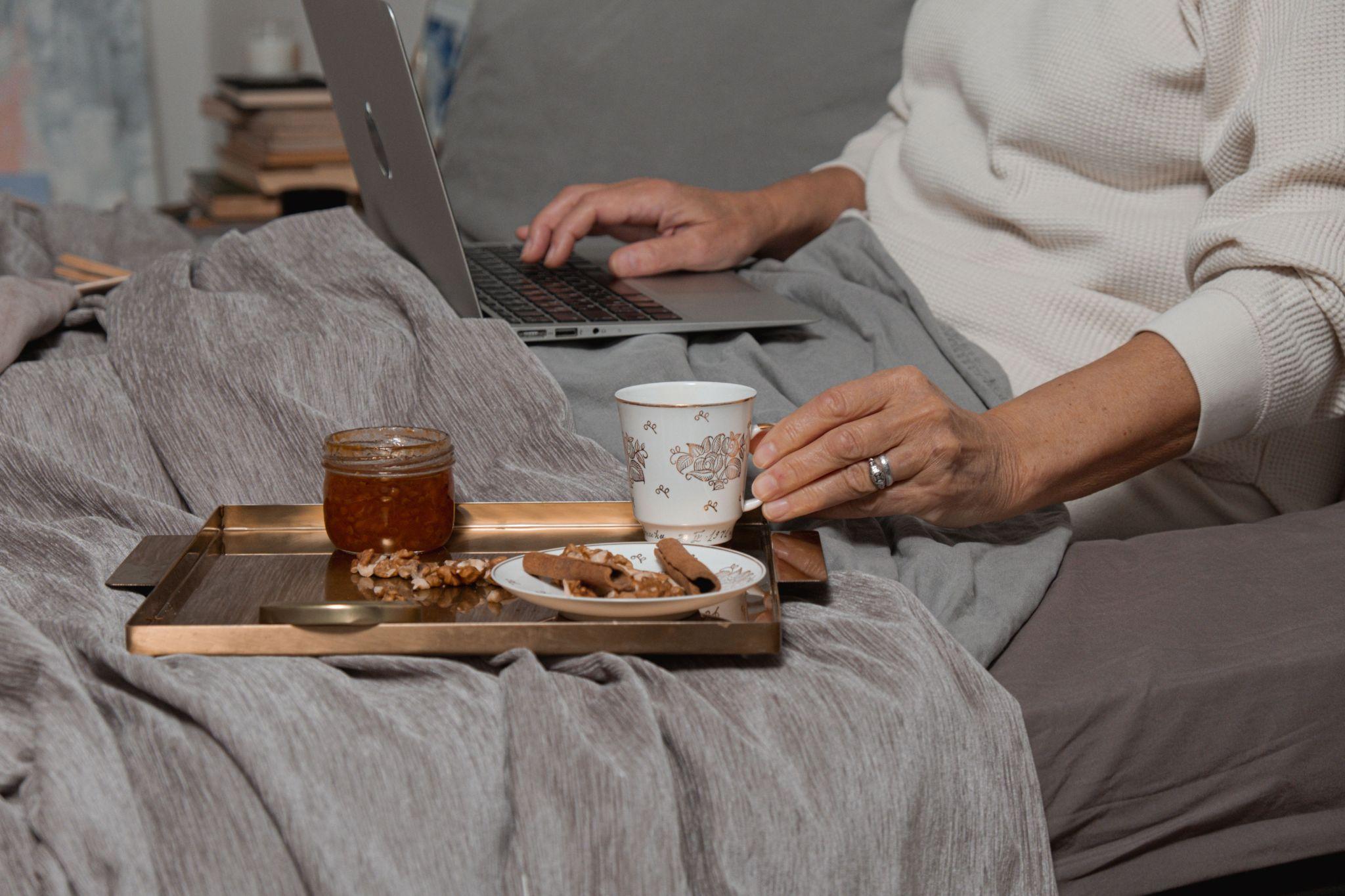 woman in bed on laptop