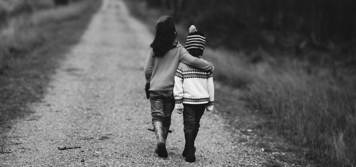 sister cheers up unhappy brother