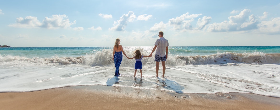 a family play in the sea on a beautiful day