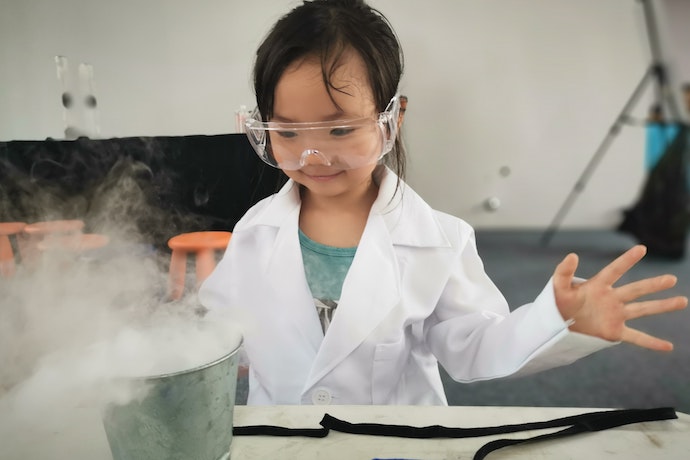 a young girl doing a science experiment