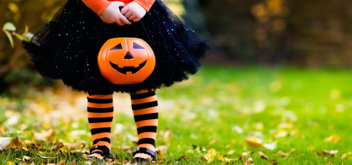 halloween, blog, halloween for kids, girl holding pumpkin at Halloween