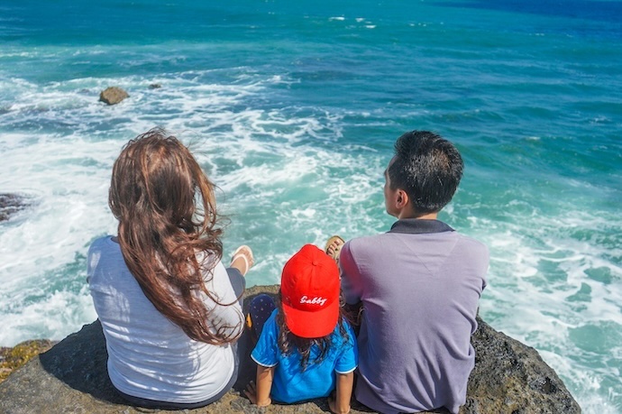 young family by the sea