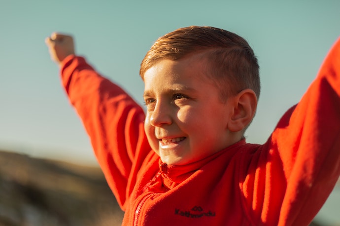 a boy celebrates