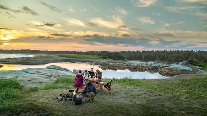 family camping near a river