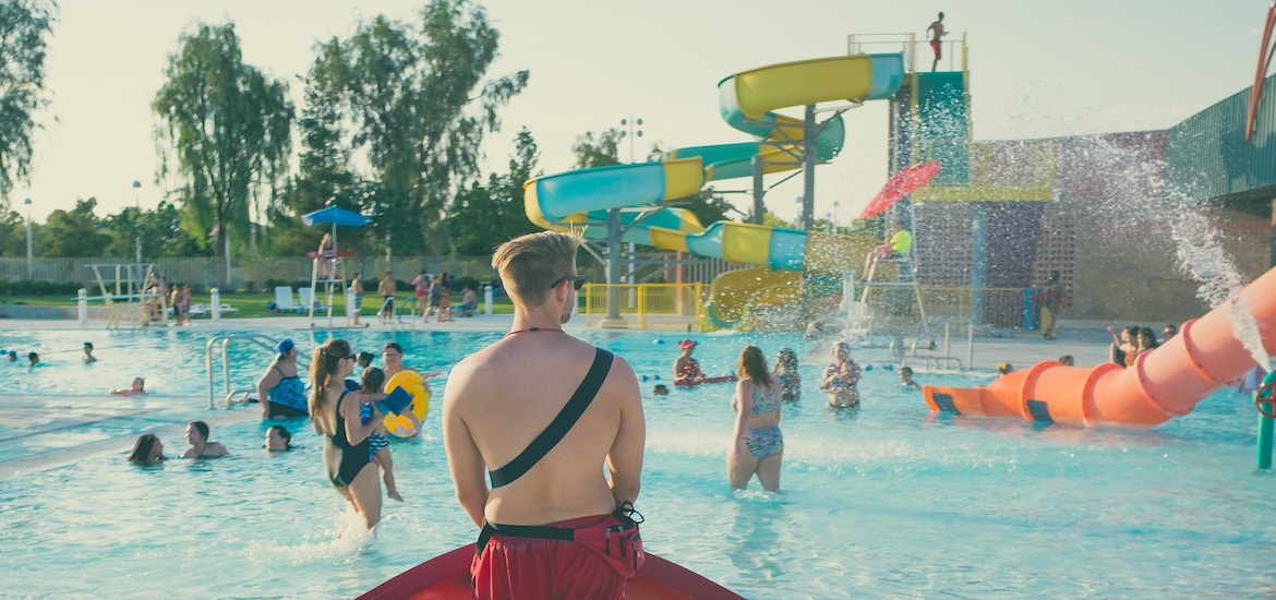 a lifeguard watches over a waterpark