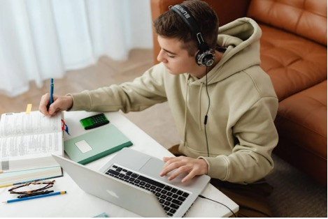 Teen using laptop