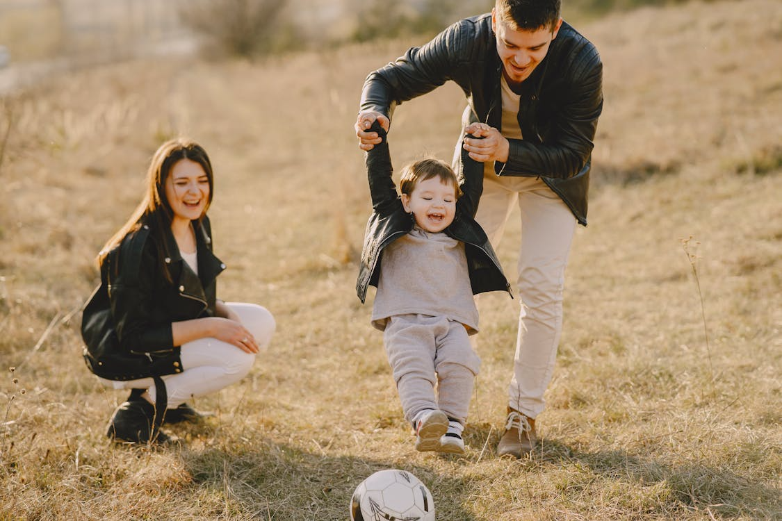 a young family play