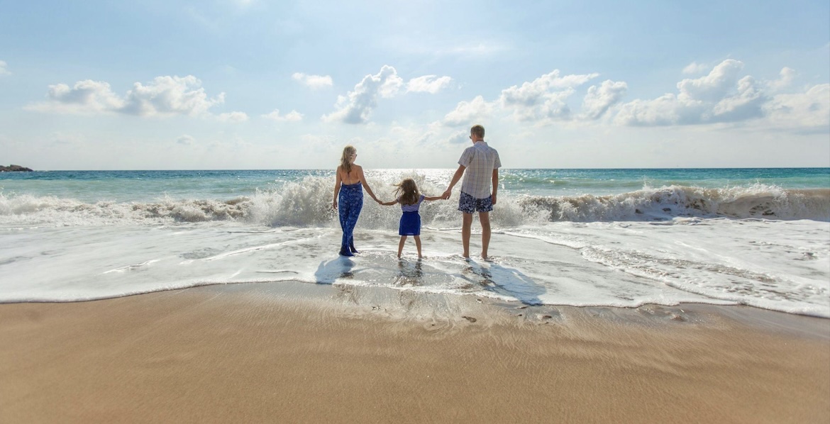 a family on a beach on holiday