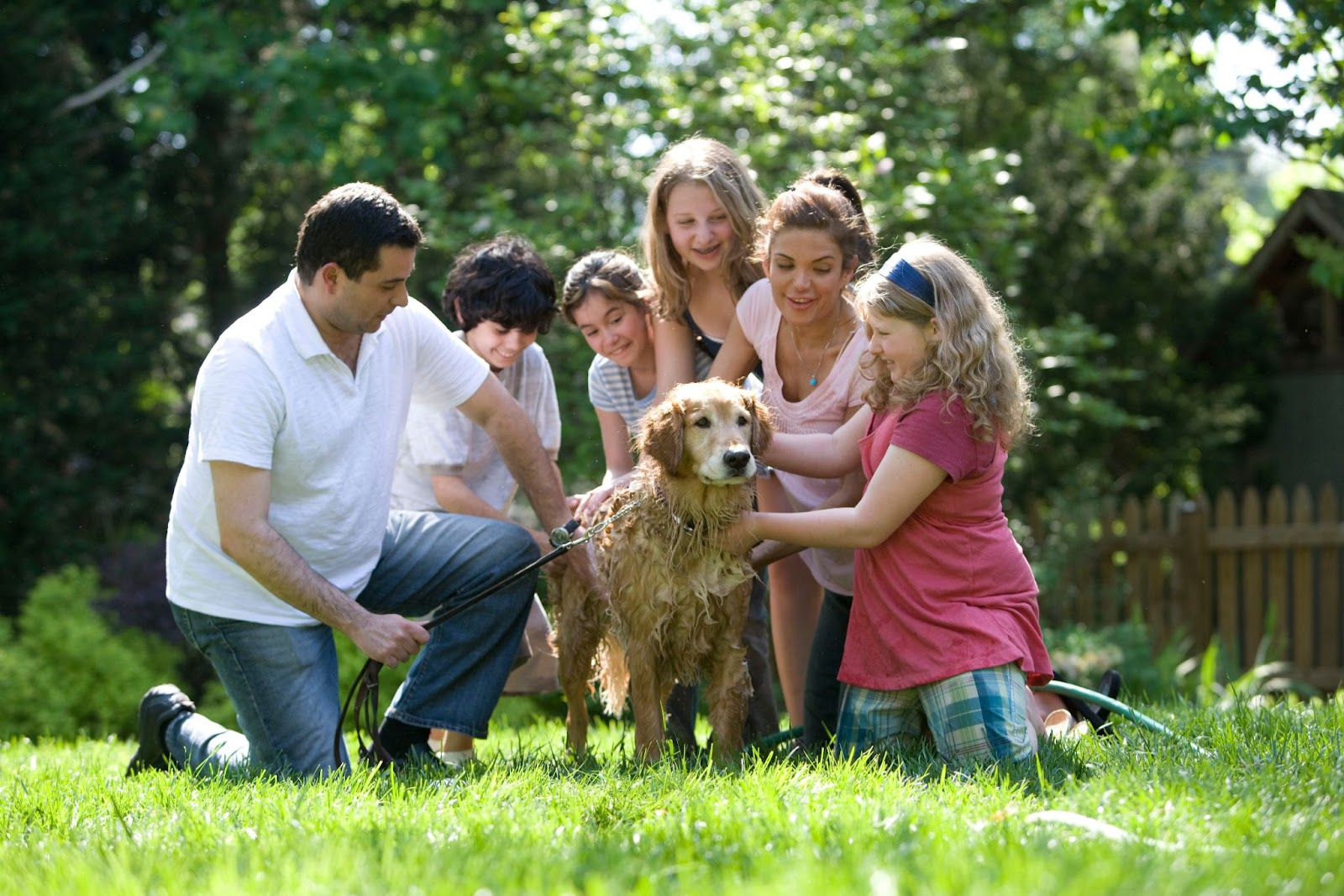 family with their pet dog