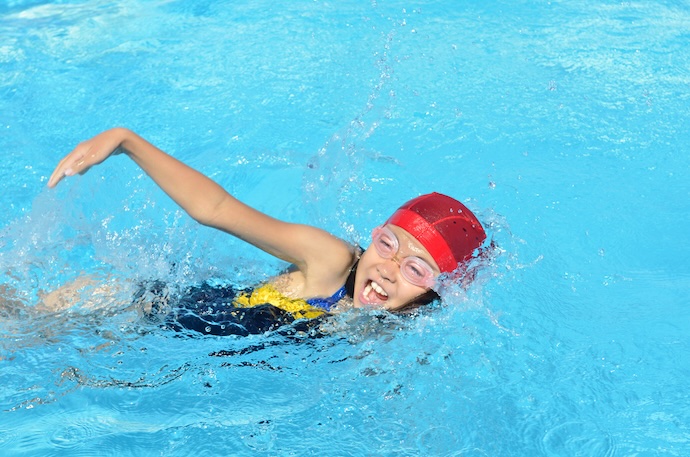 Female swimmer swimming butterfly style underwater