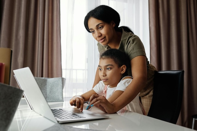 mum and daughter at laptop