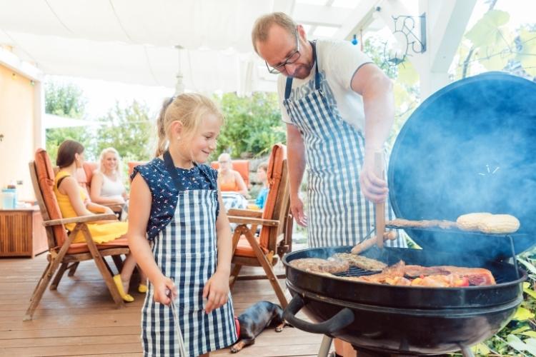 Dad and daughter BBQ'ing