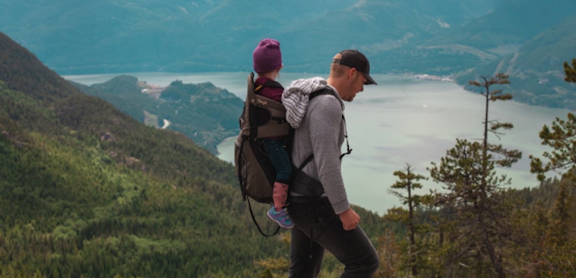 a dad and son on holiday in beautiful surroundings