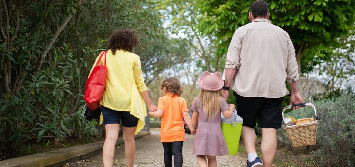 A family walks for a picnic