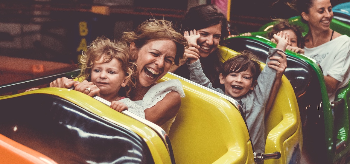 a family with young children on a rollercoaster