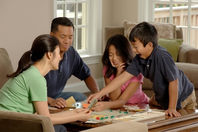 family playing boardgame