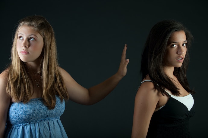 two teenage girls arguing