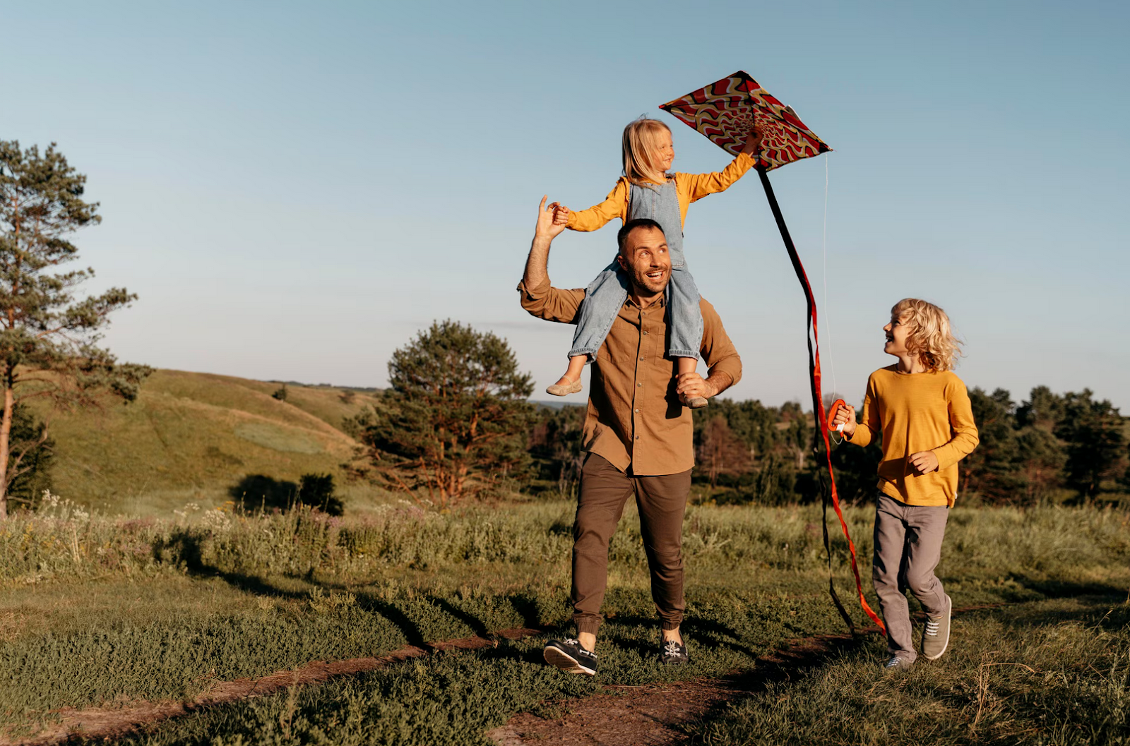 Father and Daughters Playing With Kites
