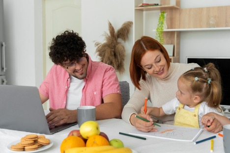 young family at laptop