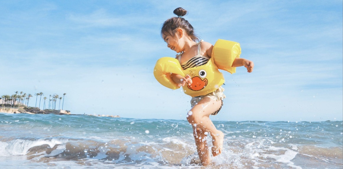girl playing on a beach