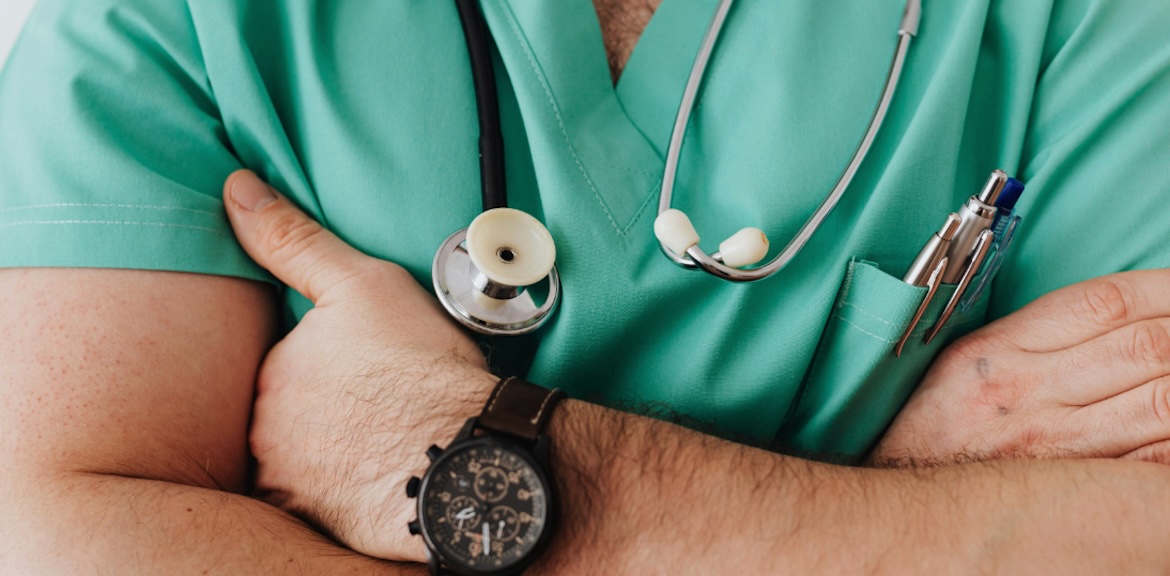 Male nurse with arms crossed