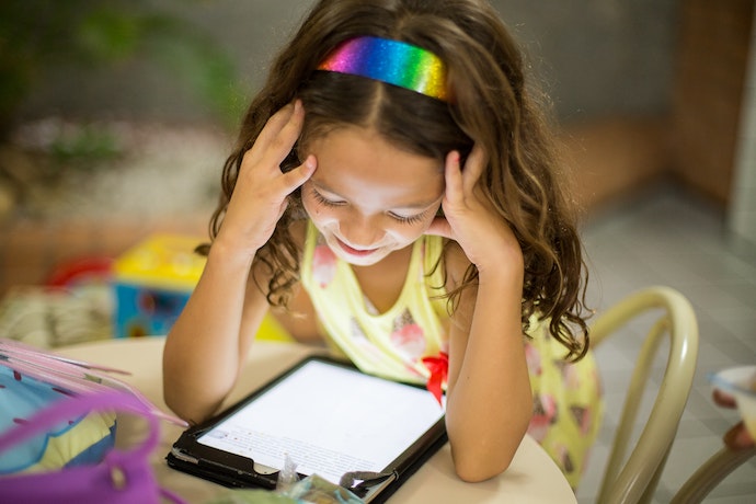 a young girl on her ipad