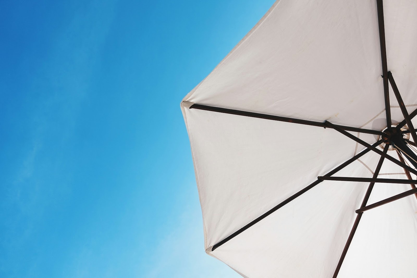 a sun parasol against blue sky