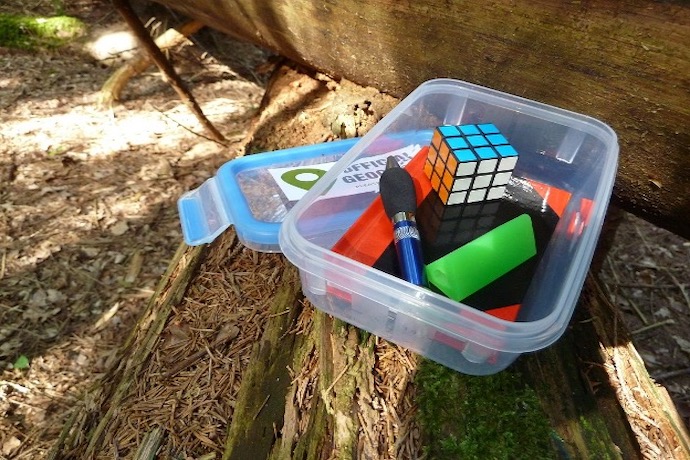 a box with geo caching materials in