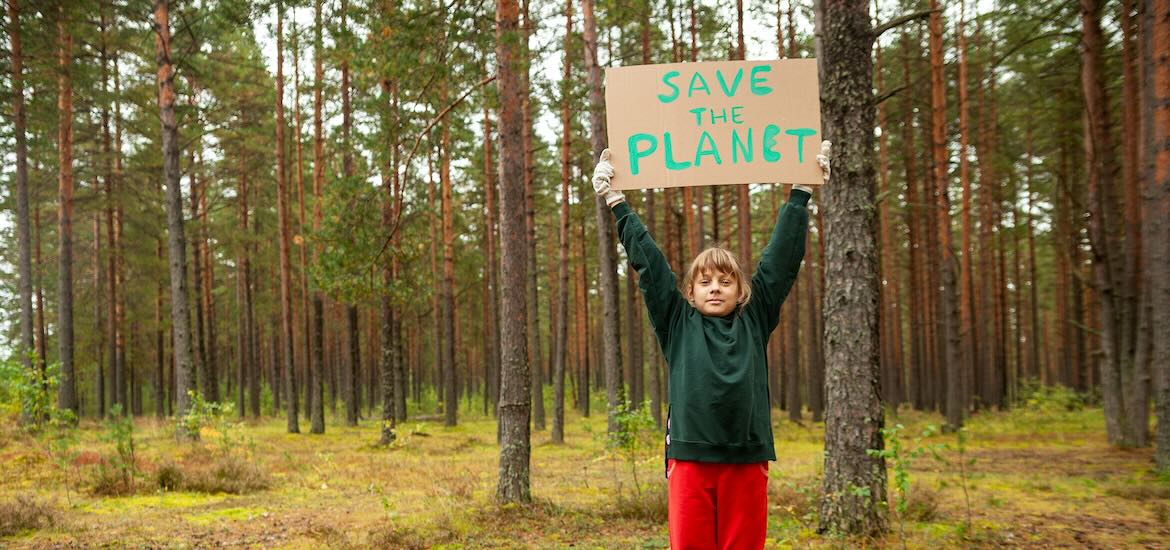 Kid with Save The Planet sign