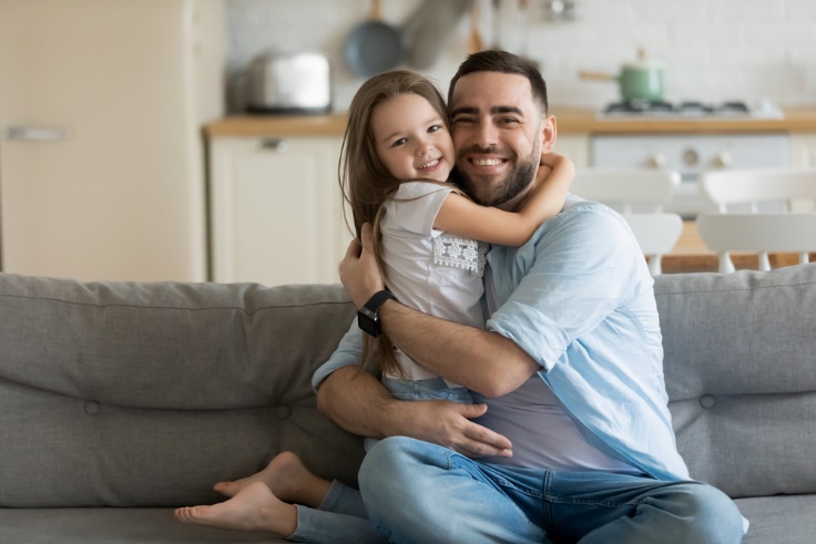 dad hugs daughter