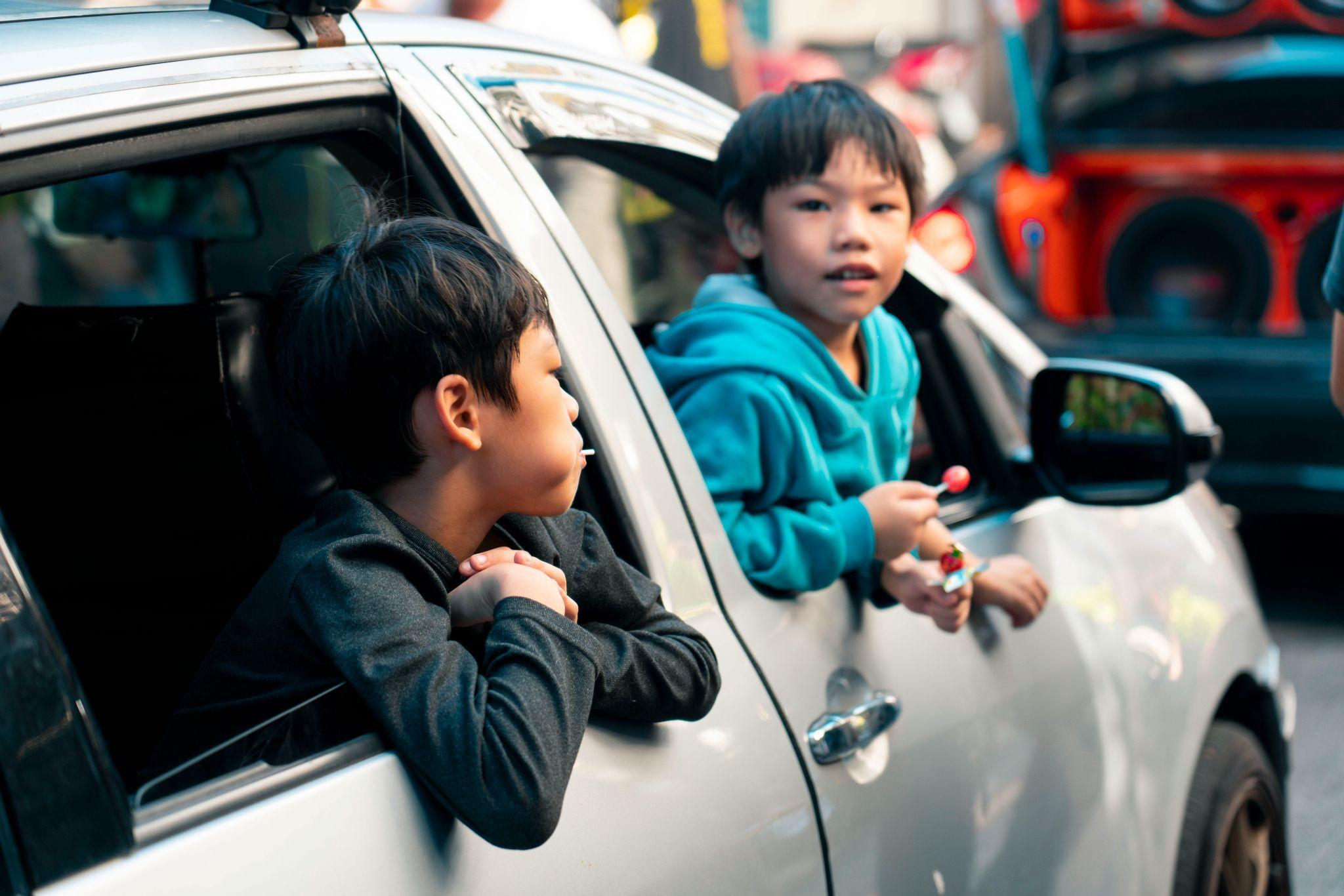 two boys in car