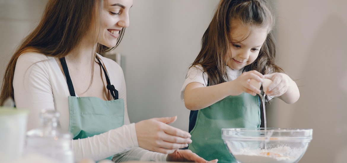 9 Indoor Activities for Keeping Kids Engaged and Learning mother cooking with daughter baking family days out